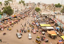aerial photography of people and vehicles near mosque at daytime
