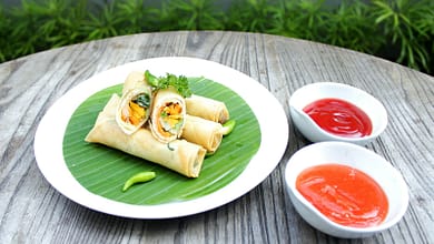 a plate of food on a wooden table