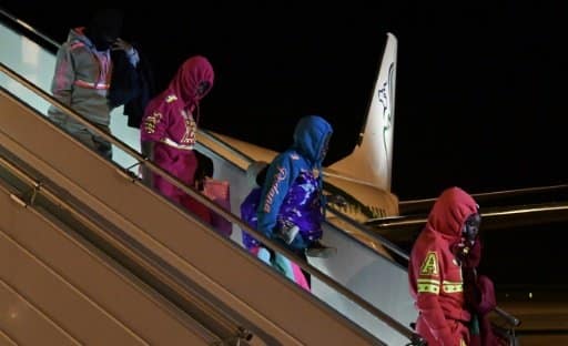 Retour de Libye à Abidjan de 155 migrants Ivoiriens après l'indignation provoquée par la vente aux enchères de d'Africains noirs dans ce pays | AFP | ISSOUF SANOGO