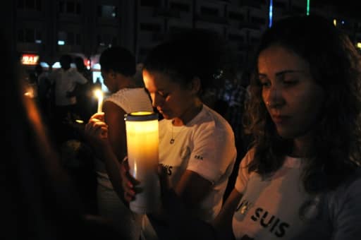 Marche silencieuse et veillée en hommage aux victimes de l'attaque jihadistes, le 23 janvier 2016 près de l'hôtel Splendid à Ouagadougou, au Burkina Faso | AFP | AHMED OUOBA