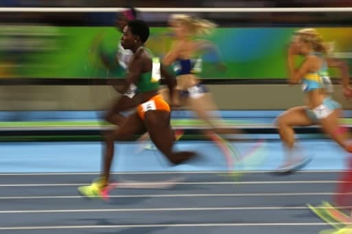 L'Ivoirienne Murielle Ahouré lors des séries du 100 m aux JO de Rio, le 12 août 2016 | AFP | Adrian DENNIS