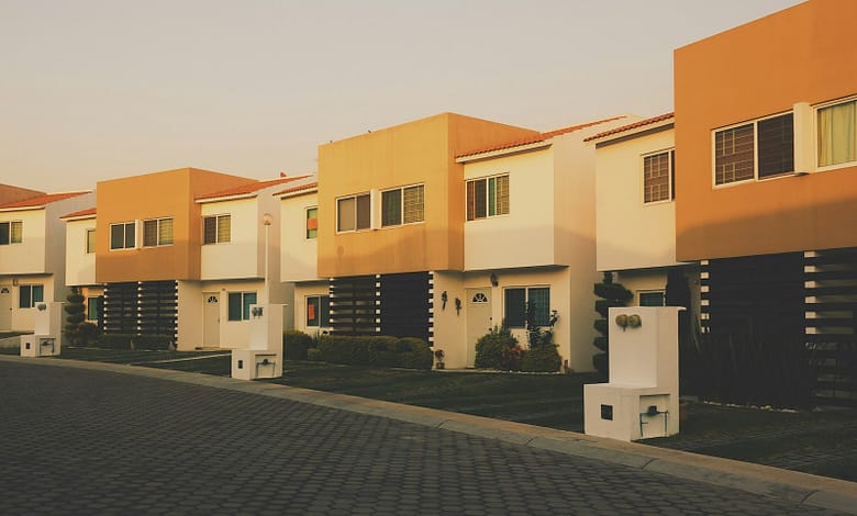 white and orange painted residential building
